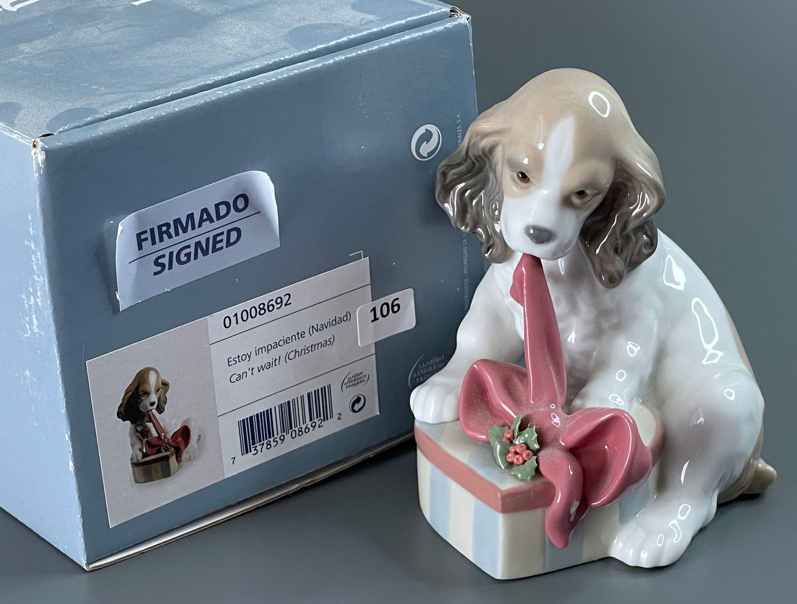 Lladro Christmas Dog with Gift Box Porcelain Figurine Item #01008692 Can t Wait! Spanish Name Estoy: Lladro Christmas Dog with Gift Box Porcelain Figurine Item #01008692 Can t Wait! Spanish Name Estoy Impaciente Navidad Sculptor Joan Coderch Year Issued 2013 Year Retired 2021