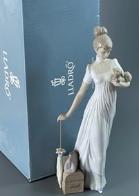 Traveling Companions 01006753 Elegant woman figurine in glossy porcelain with an umbrella in one