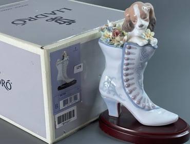 Lladro A Well Heeled Puppy 06744 Spanish Name Cobijado Entre Flores Sculptor Francisco Polope Year