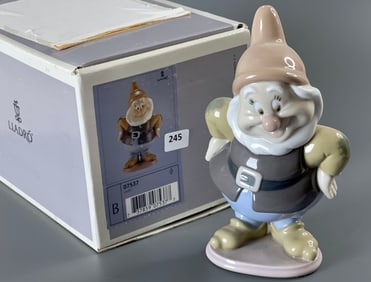 Happy Snow White Dwarf Lladro 07537 A porcelain figurine of Happy, one of the seven dwarfs from the