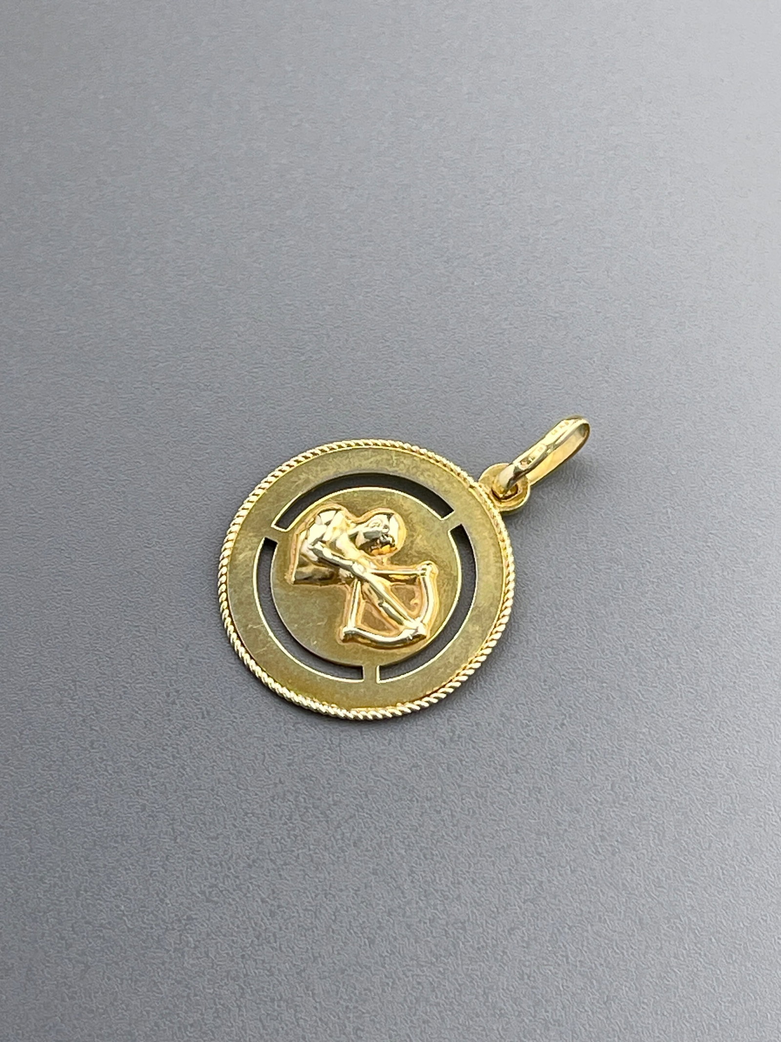 14K Gold Sagittarius Zodiac Coin Pendant: 14K Gold Sagittarius Zodiac Coin Pendant Approximately 1 1/2 x 15/16 inches.