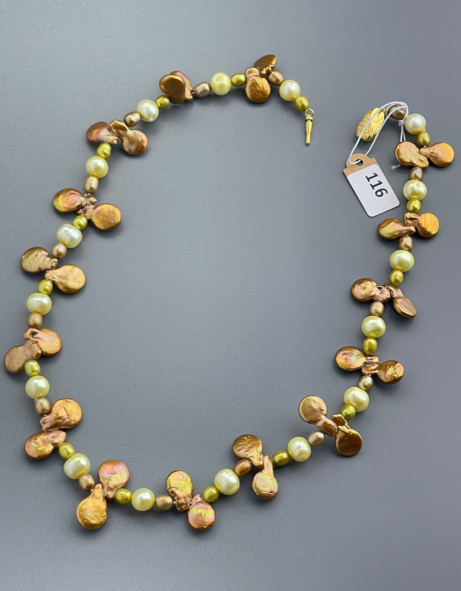 Unusual Cultured Golden Baroque Pearl Necklace: Unusual Cultured Golden Baroque Pearl Necklace Approximately 18 3/4 inches measured without the fasteners.
