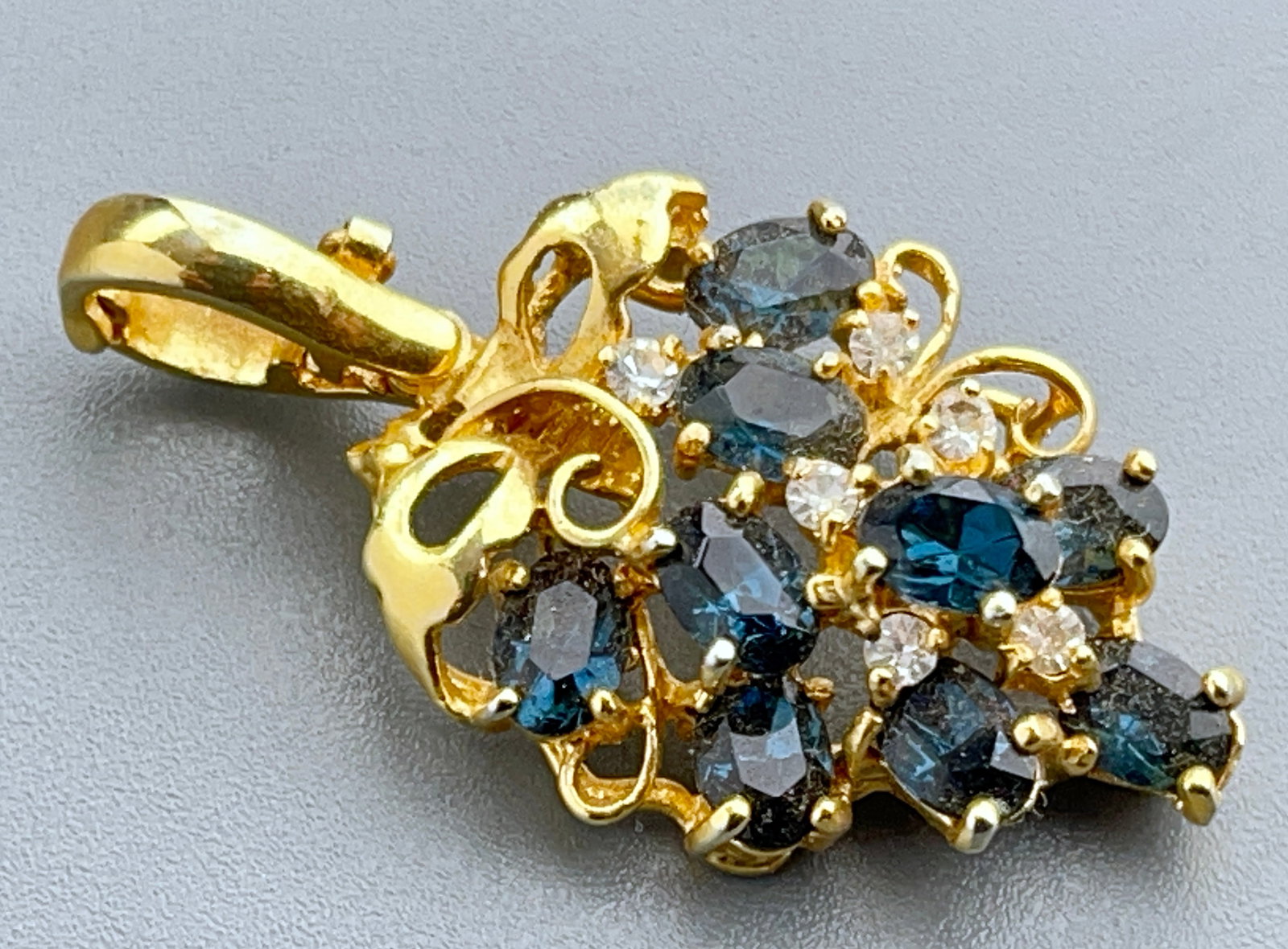 Grape Cluster Design Jeweled Pendant with Safety Bail Apparently Unmarked: Grape Cluster Design Jeweled Pendant with Safety Bail Apparently Unmarked Approximately 1 5/8 x 7/8 inches overall.