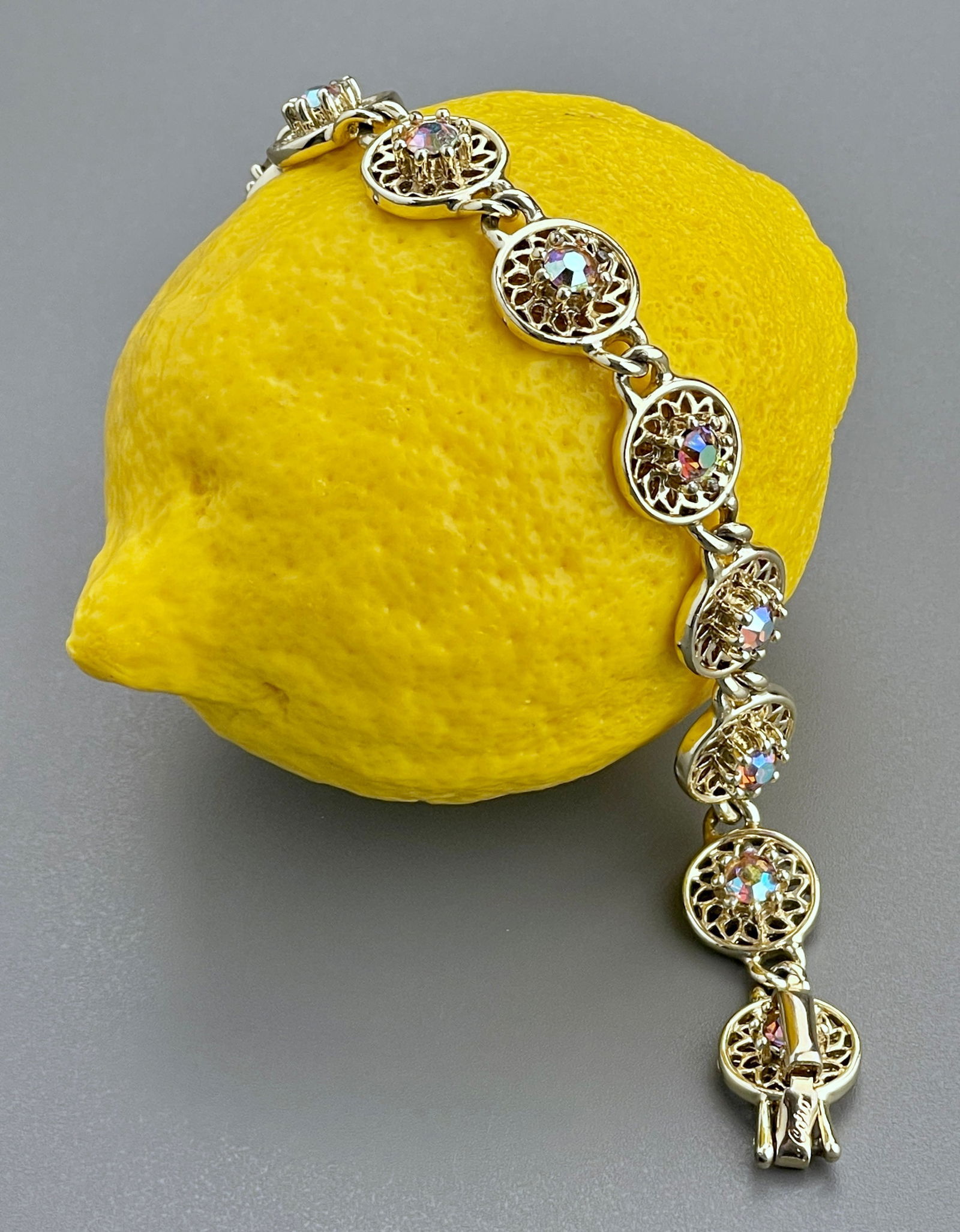 Vintage Coro Rhinestone Jeweled Filigree Link Bracelet: Vintage Coro Rhinestone Jeweled Filigree Link Bracelet Approximately 7 1/4 inches side to side.