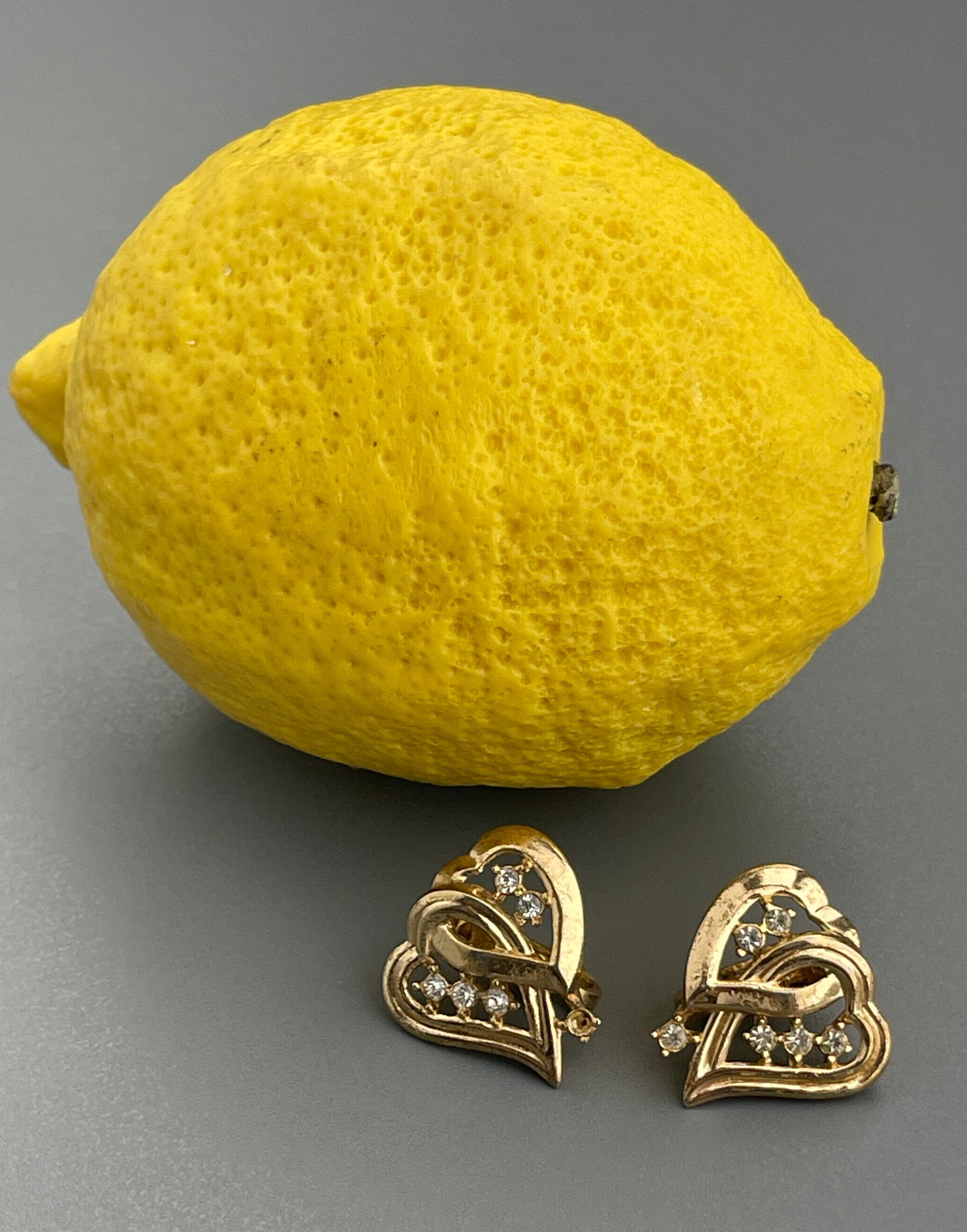 Trifari Double Heart Gold Tone Rhinestone Jeveled Vintage Clip Earrings: Trifari Double Heart Gold Tone Rhinestone Jeveled Vintage Clip Earrings Approximately 3/4 x 3/4 inches each.