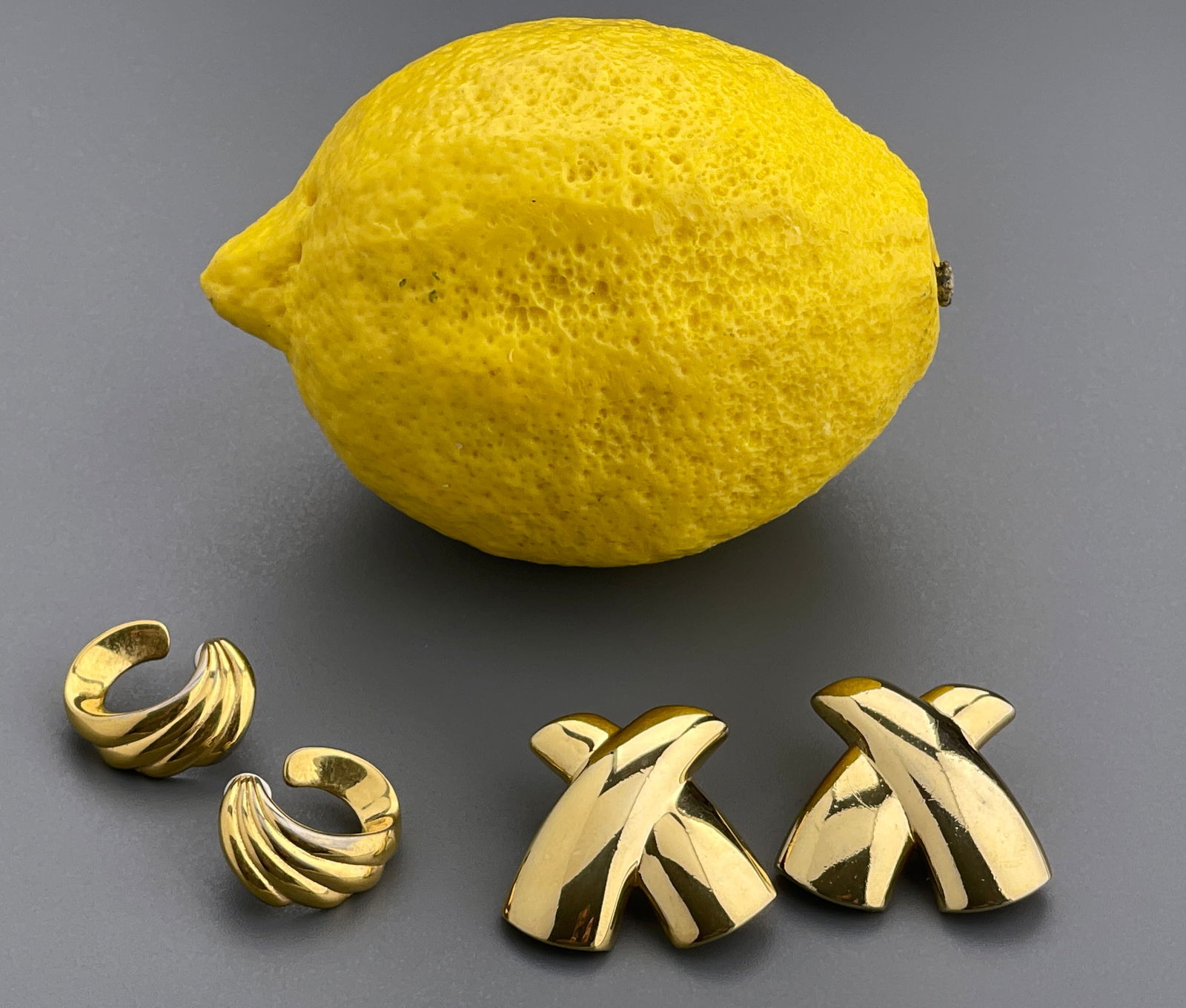 Two Pairs Gold Tone Costume Jewelry Earrings including Monet: Two Pairs Gold Tone Costume Jewelry Earrings including Monet Approximately 1 1/8 & 7/8 inches.