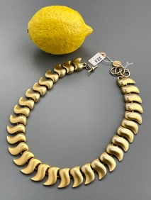 Vintage Anne Klein Gold Tone Segment Necklace    Approximately 15 1/4 inches side to side.