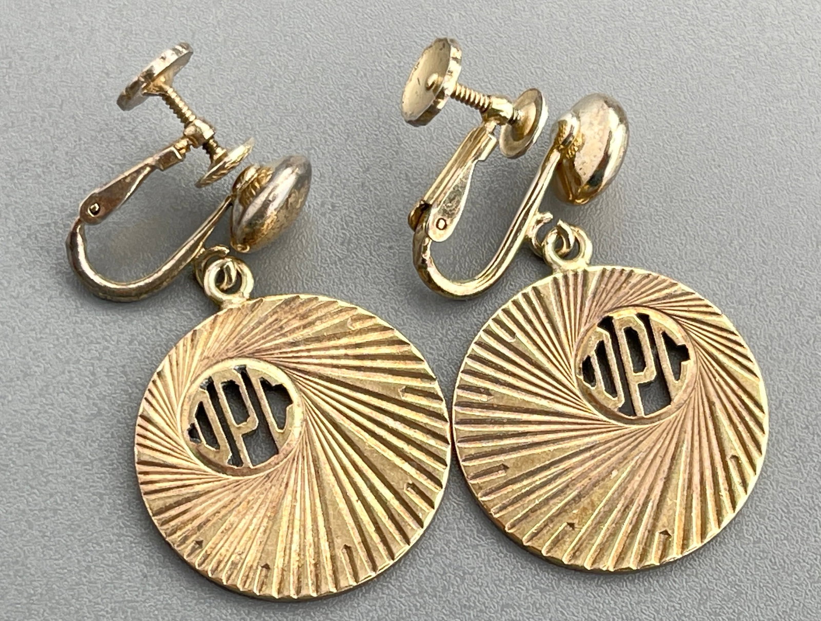 Art Deco Gold Plated DPC Monogram Clip-on Earrings c 1930s: Art Deco Gold Plated DPC Monogram Clip-on Earrings c 1930s Approximately 1 3/8 x 7/8 inches.