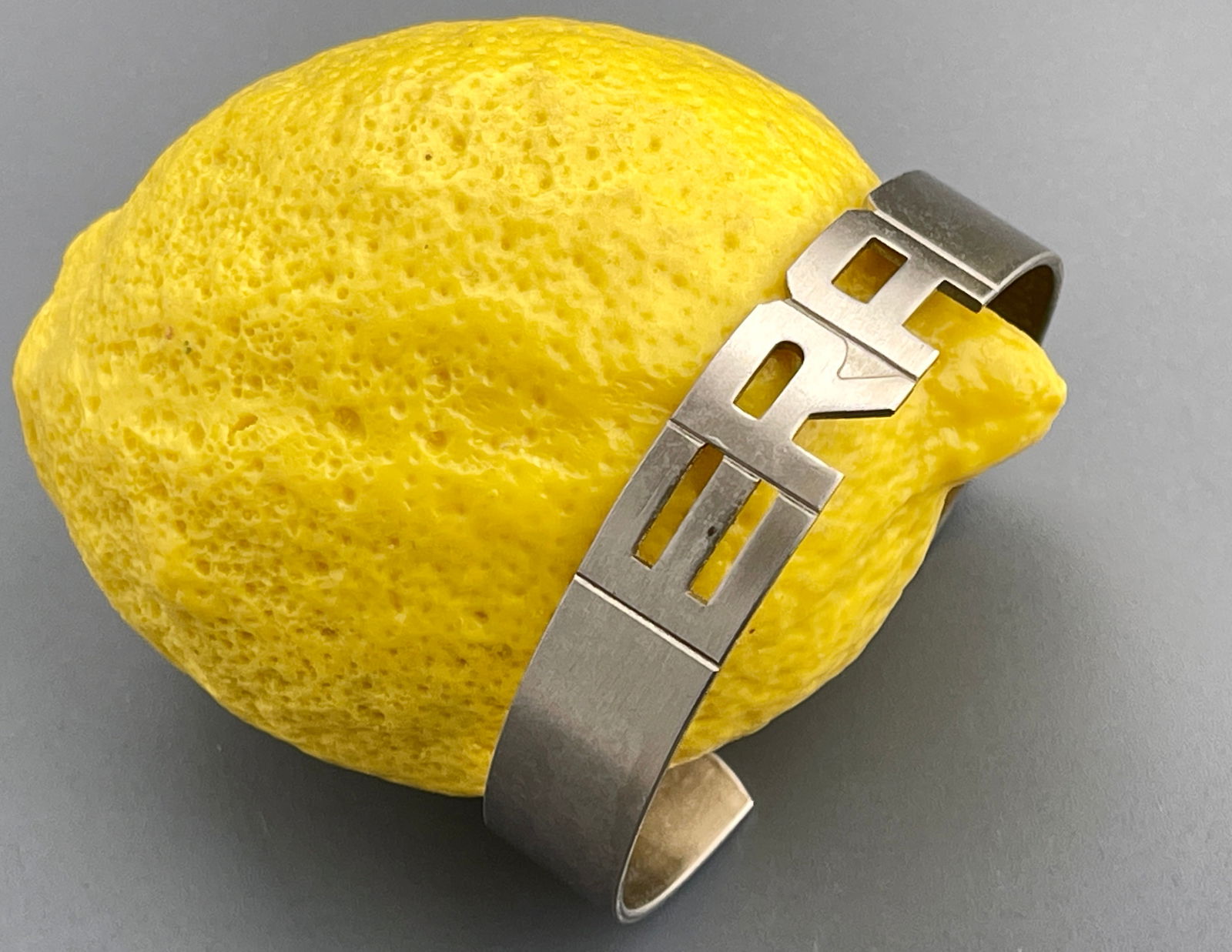 Equal Rights Amendment Vintage LWVUS Nickel Silver ERA Monogram Cuff Bracelet: Equal Rights Amendment Vintage LWVUS Nickel Silver ERA Monogram Cuff Bracelet Approximately 2 1/2 x 2 1/8 inches.