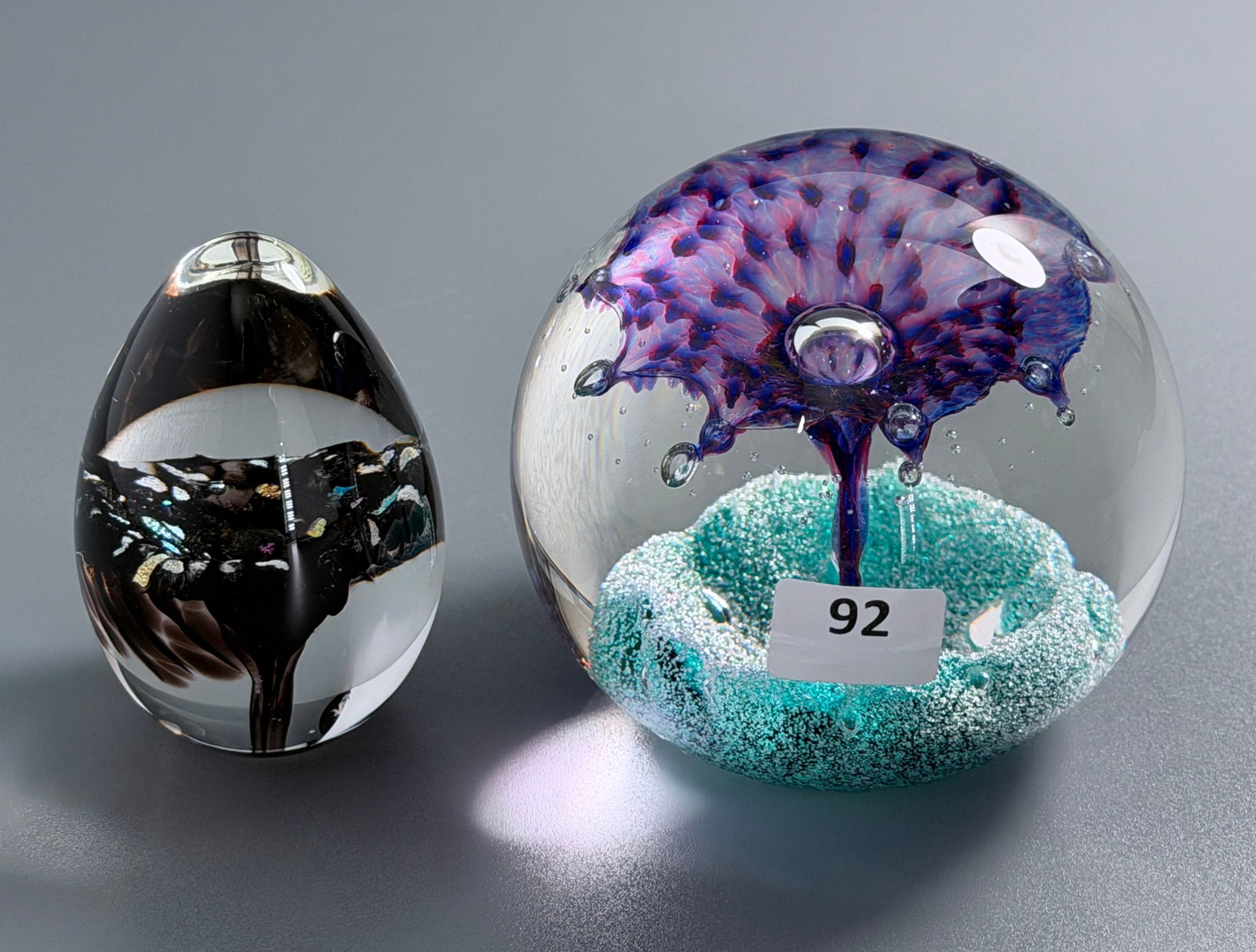 Caithness Scotland Fountain Art Glass Ball Paperweight together with GES Art Glass Studio Egg Shaped: Caithness Scotland Fountain Art Glass Ball Paperweight together with GES Art Glass Studio Egg Shaped Paperweight Both Signed Approximately 3 and 2 3/4 inches tall. For all high ticket items, including