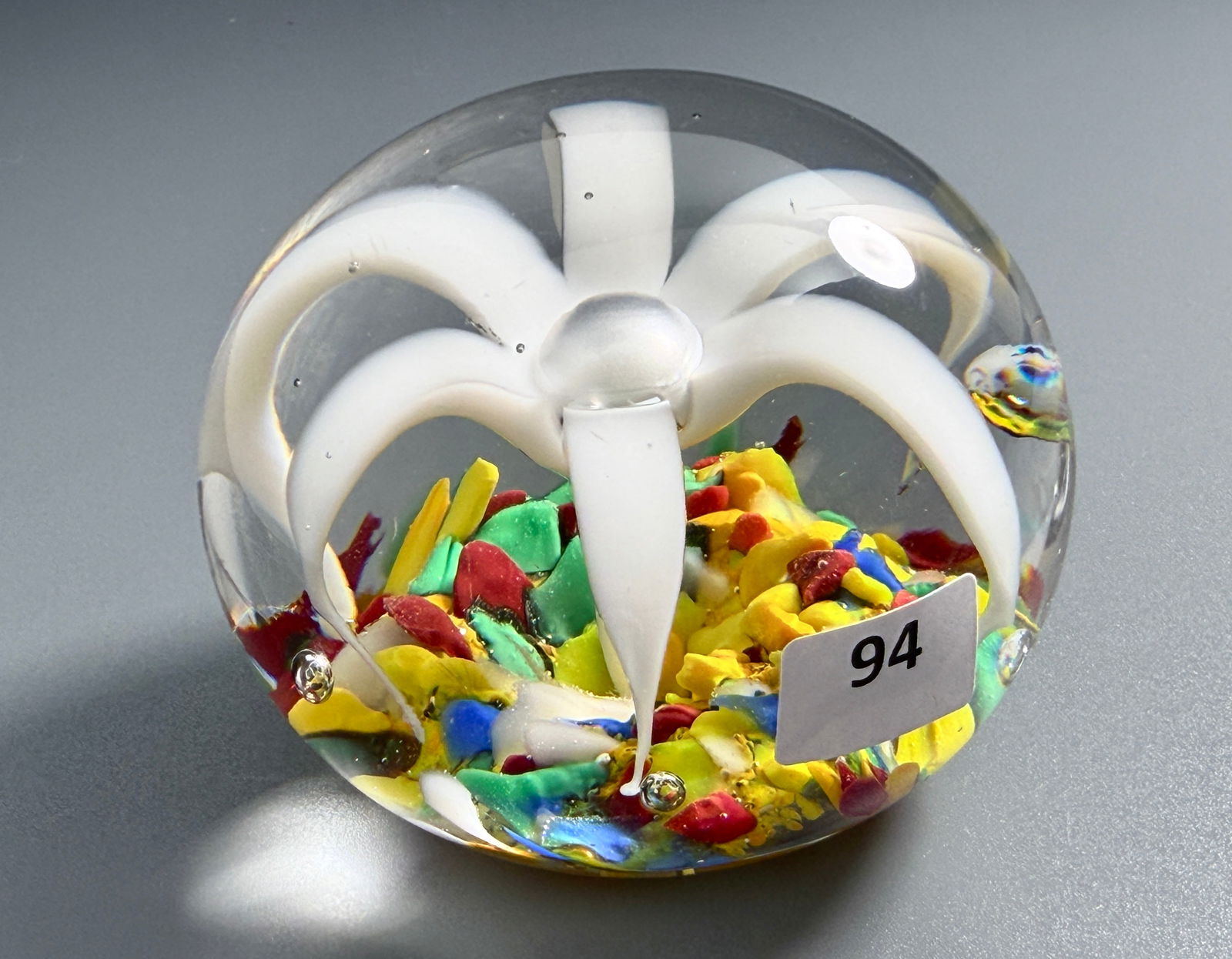 Vintage Paperweight White Flower on Colorful Molted Background: Vintage Paperweight White Flower on Colorful Molted Background Approximately 3 inches in diameter. For all high ticket items, including watches and jewelry, thebuyer identity has to be confirmed prior