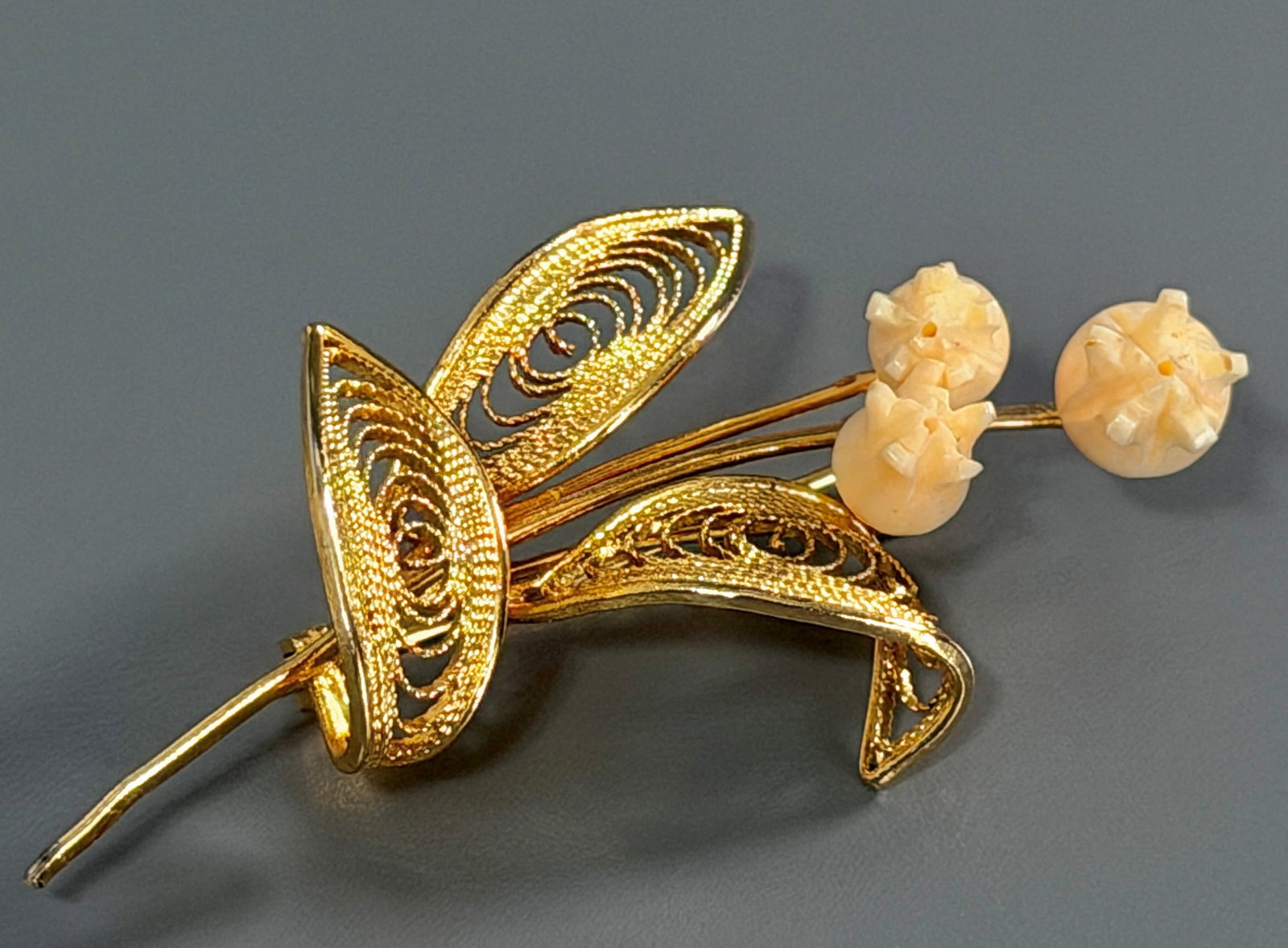 Karen Lynne for Charles Rothman Style Filigree Leaves Lily of Valley Brooch with Carved Flowers: Karen Lynne for Charles Rothman Style Filigree Leaves Lily of Valley Brooch with Carved Flowers circa 1960s-1970s. Unsigned attributed to Karen Lynne. Approximately 2 1/8 x 1 inches. For all high tick