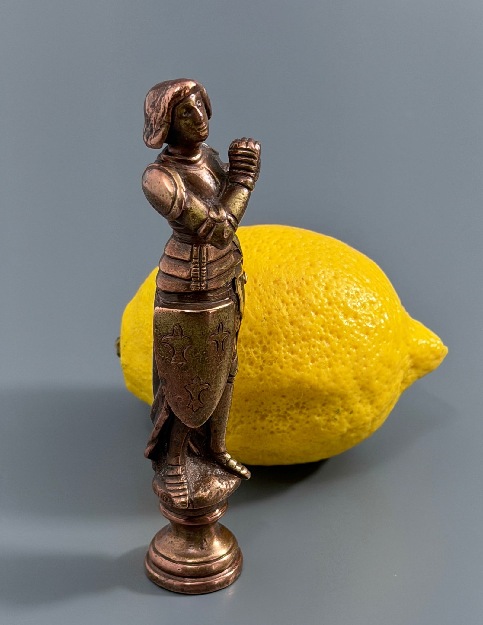 Saint Joan of Arc French Bronze Wax Seal Small Antique Desktop Figurine in Armor Holding a Shield: Saint Joan of Arc French Bronze Wax Seal Small Antique Desktop Figurine in Armor Holding a Shield with a Coat of Arms Approximately 4 5/8 inches tall.