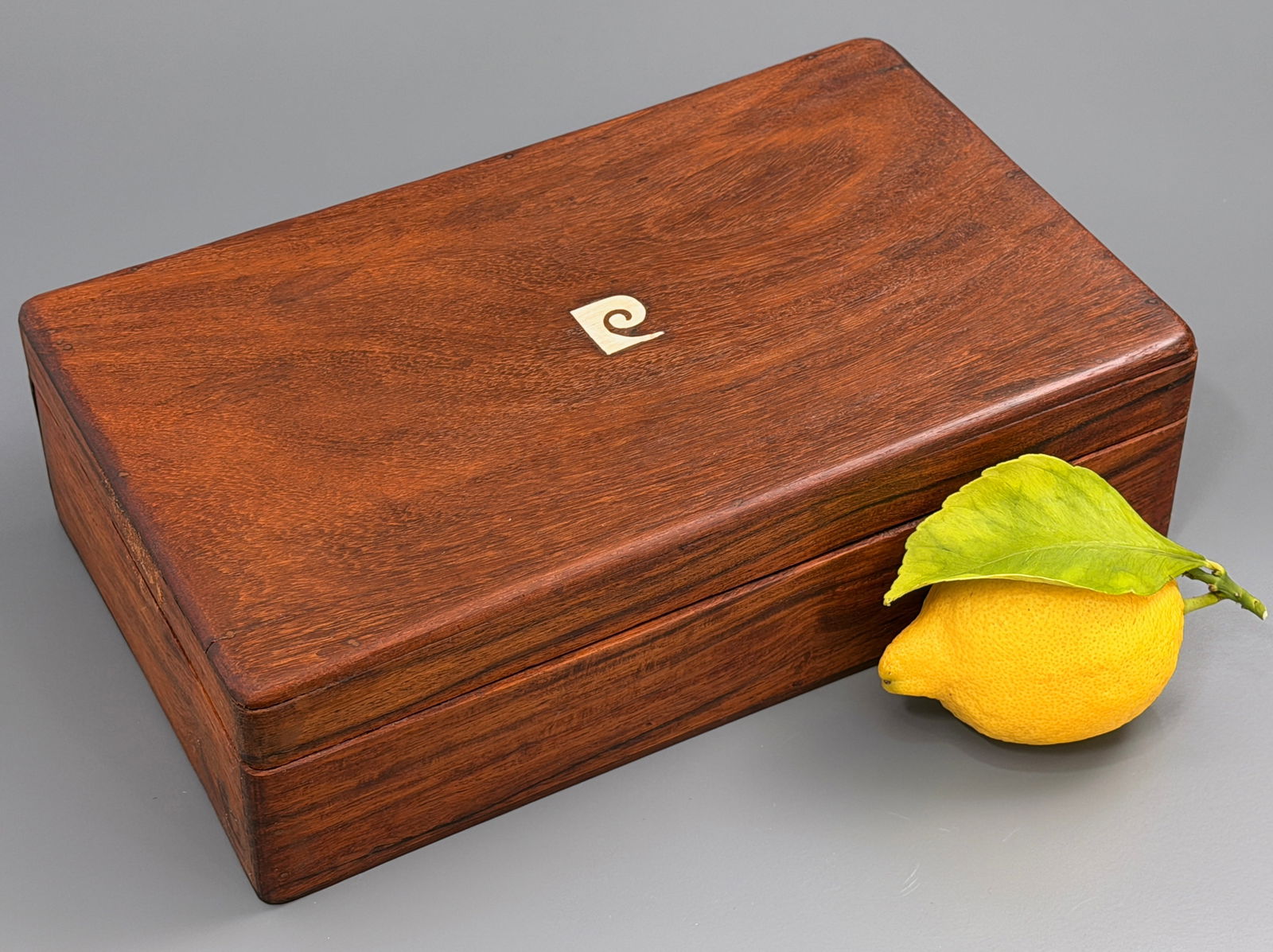 Vintage Mid Century Teak Wood Pierre Cardin Box with Inlaid P Logo Manufactory Mark on Hinged Lid: Vintage Mid Century Teak Wood Pierre Cardin Box with Inlaid P Logo Manufactory Mark on Hinged Lid Approximately 10 x 6 x 2 7/8 inches.