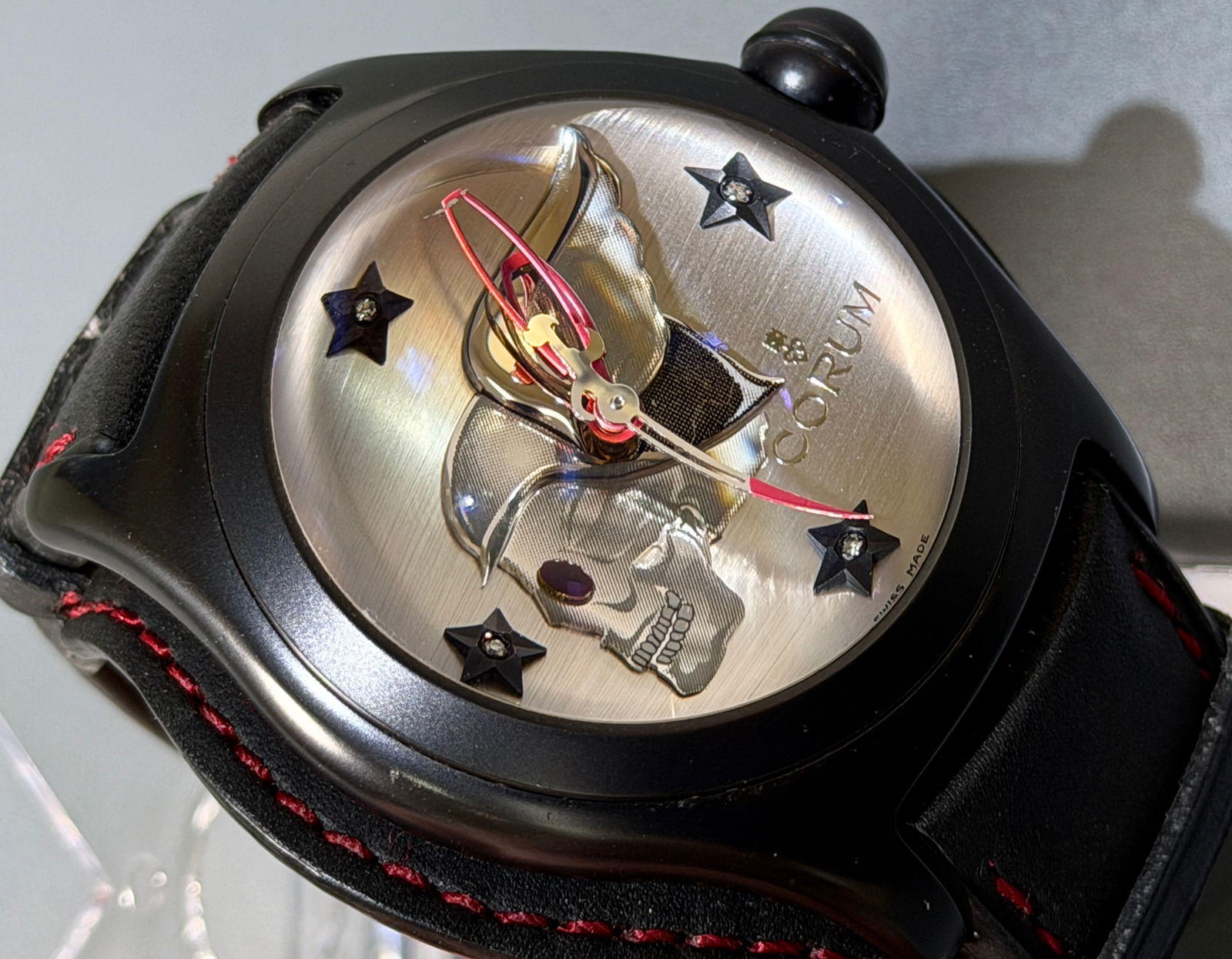 Corum Bubble XL Night Flyer Biker Watch Rare Limited Edition Timepiece Embossed Winged Skull Dial: Corum Bubble XL Night Flyer Biker Watch Rare Limited Edition Timepiece Embossed Winged Skull Dial with Diamond Jeweled Black Stars Hour Markers Domed Sapphire Crystal Swiss Automatic Movement Black Le