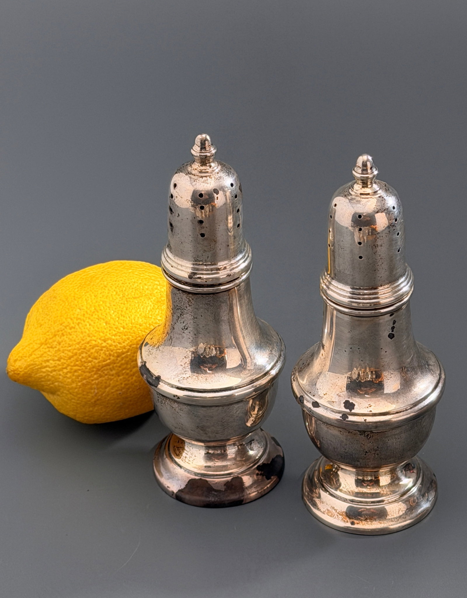 Vintage American Sterling Silver Salt & Pepper Shakers Baluster Form Pattern 1202: Vintage American FTG Sterling Silver Salt And Pepper Shakers Baluster Form Pattern 1202 on pedestal bases with friction fit dome shaped covers. Approximately 4 3/4 inches tall.