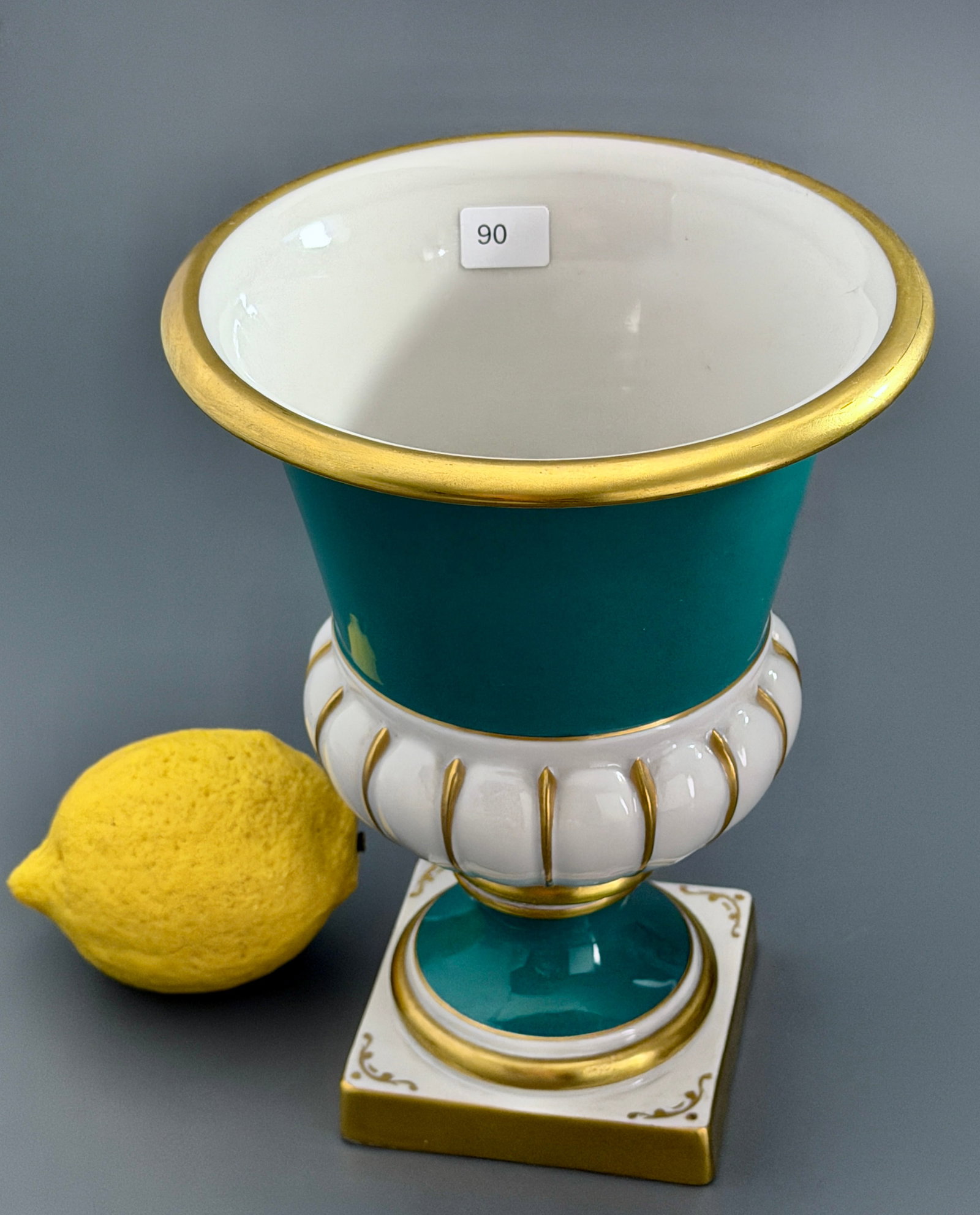 Portuguese Ceramic Hand Painted Campana Urn Vase Gilt Turquoise Teal Emerald Vintage Gilded Rim: Portuguese Ceramic Hand Painted Campana Urn Vase Gilt Turquoise Teal Emerald Vintage Gilded Rim Bolted Square Plinth Base Porcelain Approximately 7 3/4 inches tall, with a top rim diameter approximate