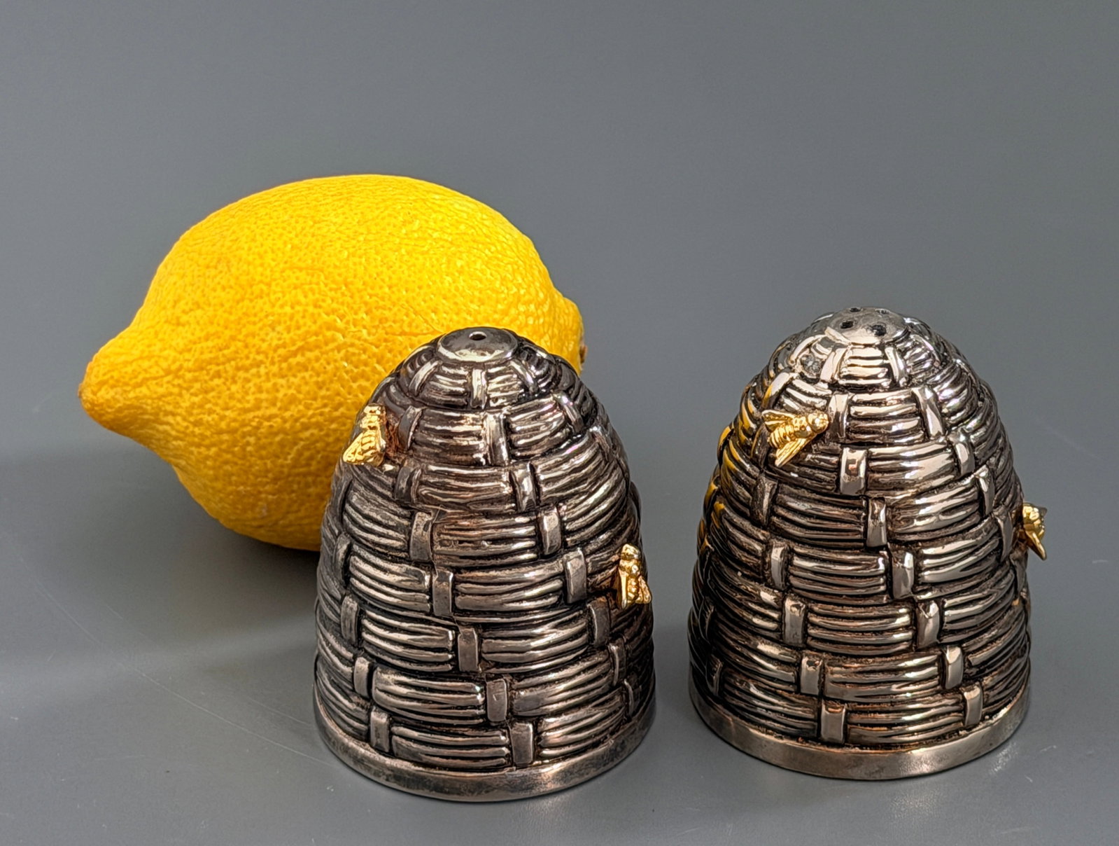 Vintage Silver Plated Beehive Gilt Bees Skep Salt & Pepper Shakers Pair: Vintage Silver Plated Beehive Gilt Bees Skep Salt & Pepper Shakers Pair Approximately 2 1/4 inches tall x 1 3/4 inches in diameter..