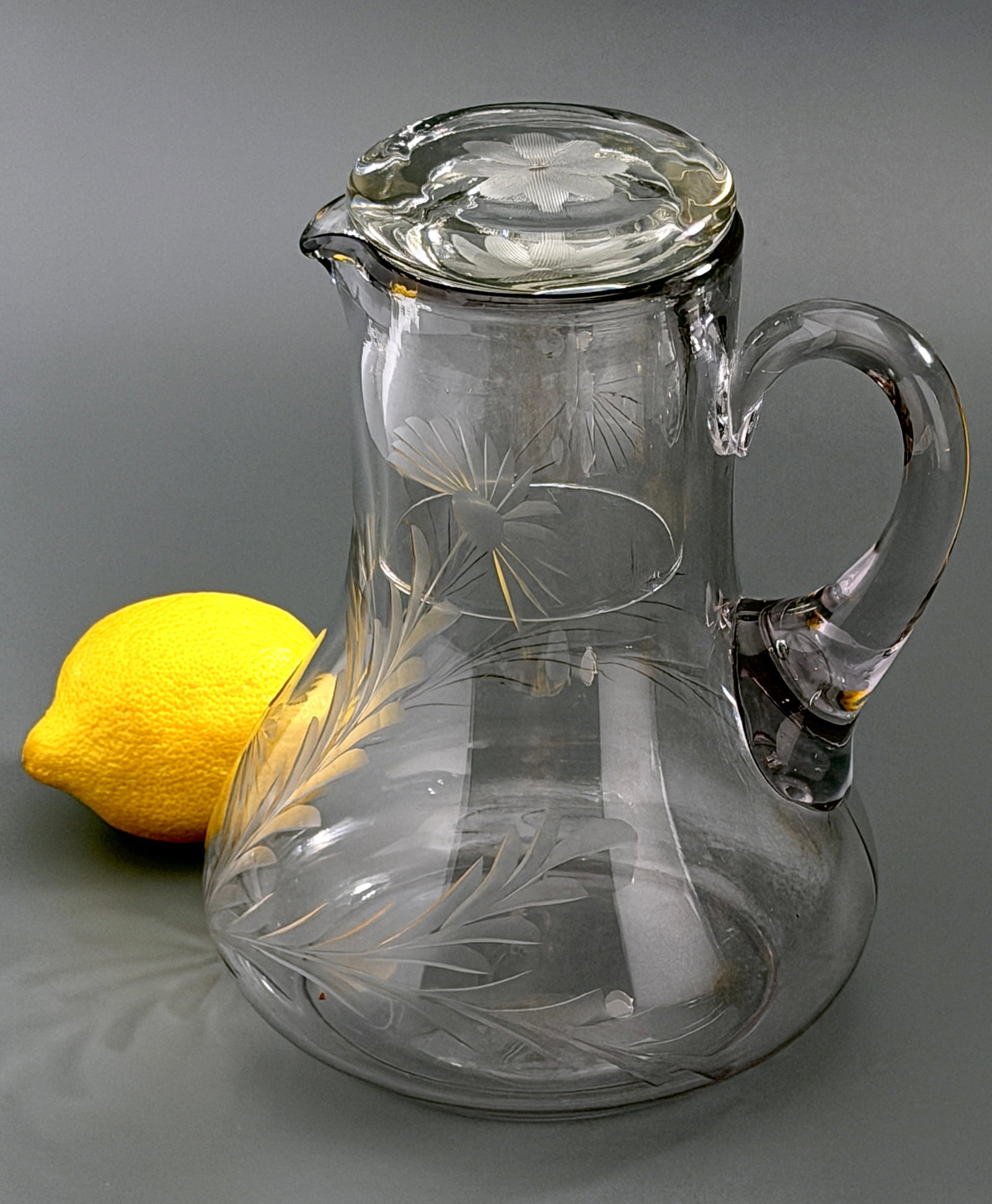 Vintage Elegant Cut Glass Tumble Up Nightstand Water Carafe Set With Intaglio Floral Design: Vintage Elegant Cut Glass Tumble Up Nightstand Water Carafe Set With Intaglio Floral Design Approximately 7 x 5 3/4 x 7 3/8 inches tall overall.