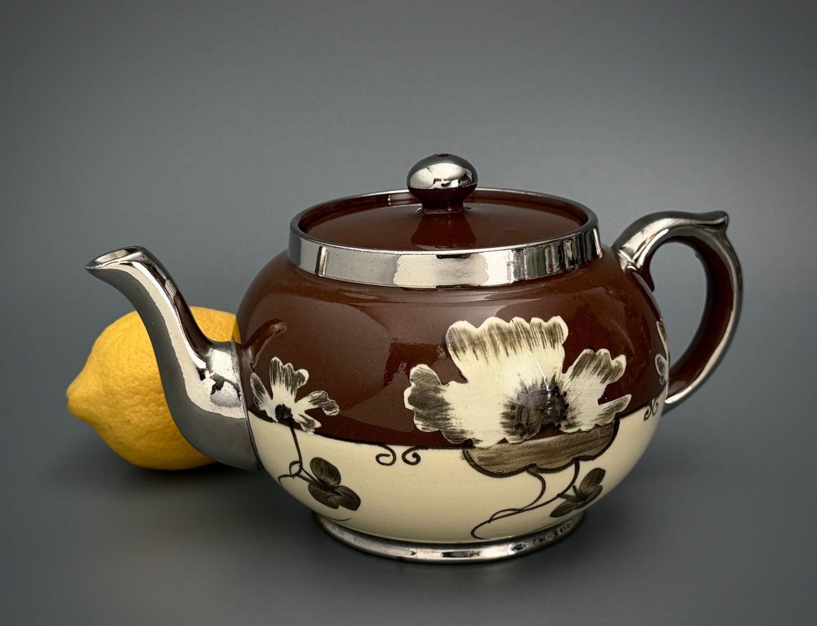British Ceramic Staffordshire Teapot Chocolate Brown Glaze Silver Luster Gibsons Pottery: British Ceramic Staffordshire Teapot Chocolate Brown Glaze Silver Luster Gibsons Pottery Approximately 8 x 5 1/4 x 5 inches tall.