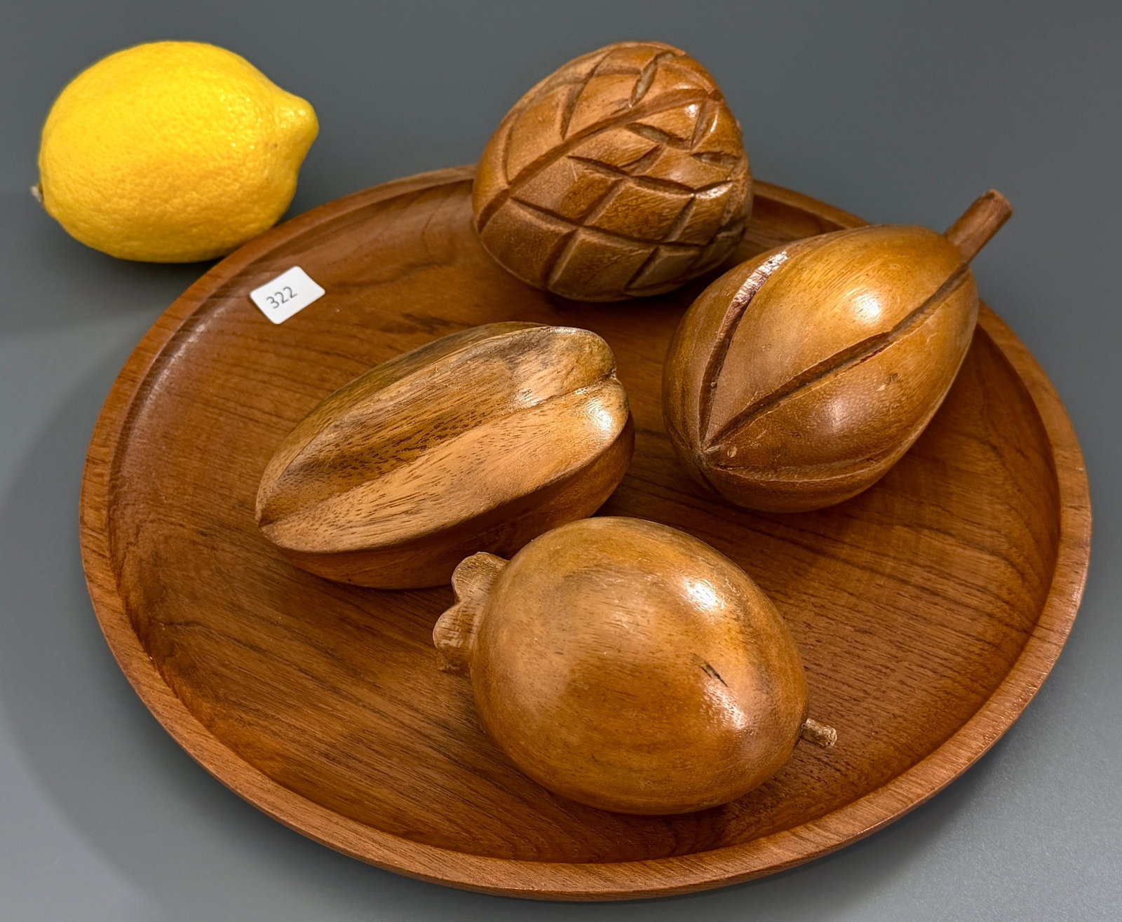 Mid Century Hand Carved Exotic Fruit Display & Wooden Charger Plate: Vintage Mid Century Hand Carved Exotic Fruit Display & Wooden Charger Plate The plate is approximately 9 3/4 inches in diameter.