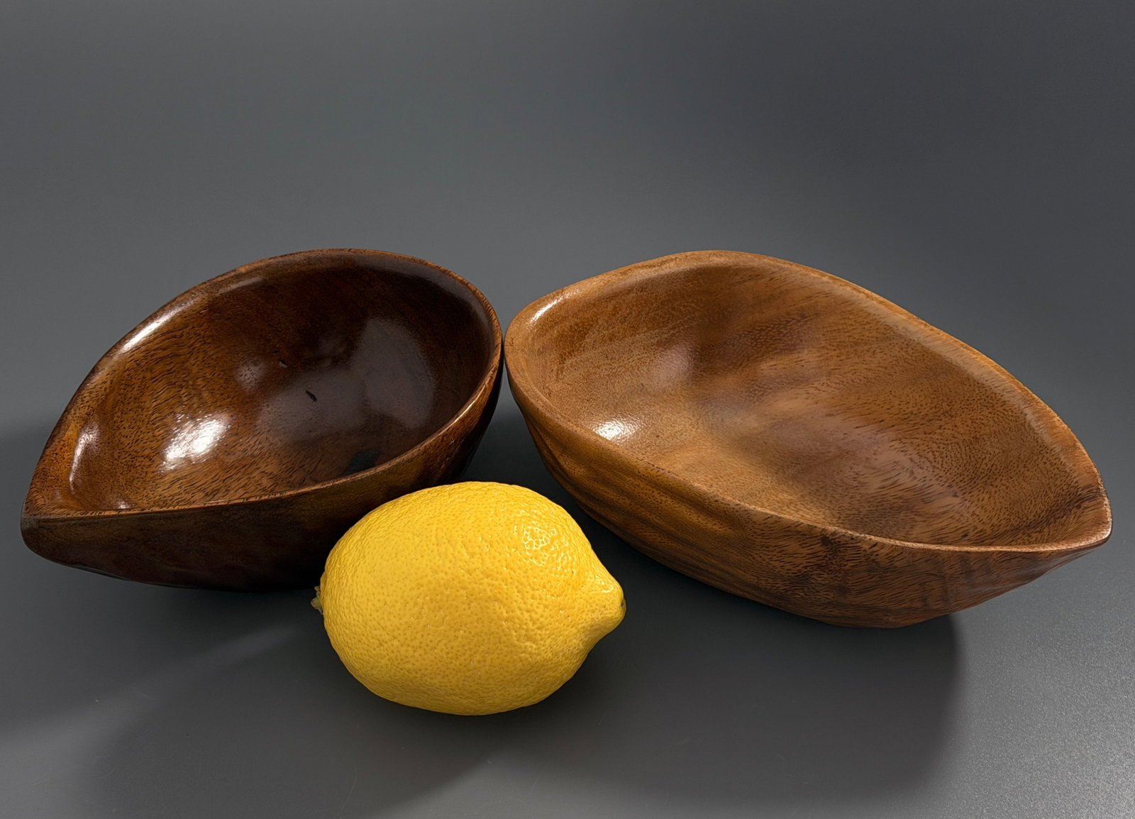 Vintage Monkey Pod Wood Teardrop Tiki Bowls Mid Century Modern Hand Carved Serving Dish Pair: Vintage Monkey Pod Wood Teardrop Tiki Bowls Mid Century Modern Hand Carved Serving Dish Pair Approximately 7 x 4 1/4 x 2 1/8 inches tall and 6 x 4 1/8 x 2 1/8 inches tall.