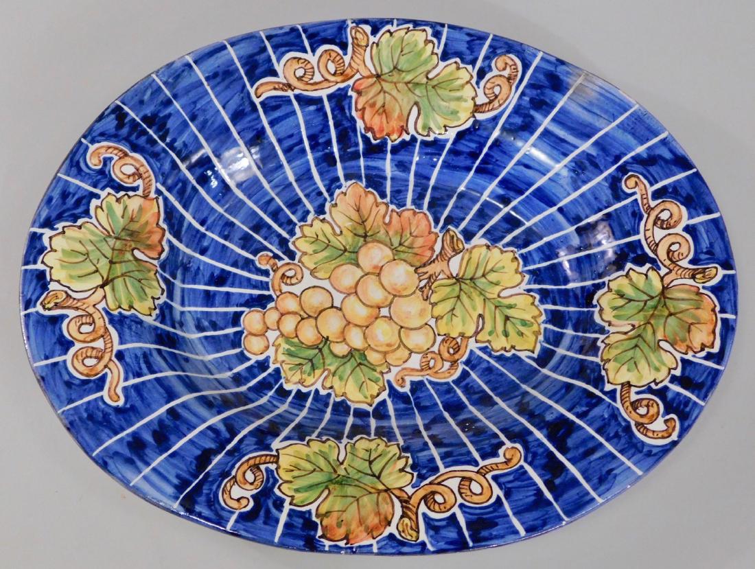 Italian Majolica Pottery Oval Hanging Plaque Grapes: Italian Majolica Pottery Oval Hanging Plaque Grapes Wall Plate Approximately 10 1/8 x 8 1/8 inches. This lot is part of inventory from a closed antique store, which we will be auctioning during the ne