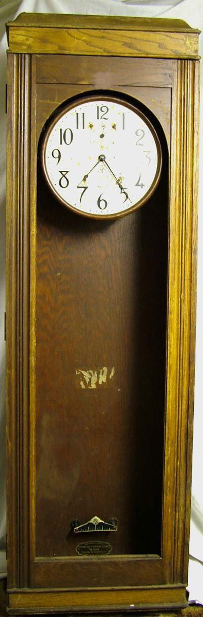 International Time recorders: International Time recorders, central master wall clock, circa early 20C, very large oak case, approx. 5' tall, dial & case in poor condition, no glass in door [no shipping available]