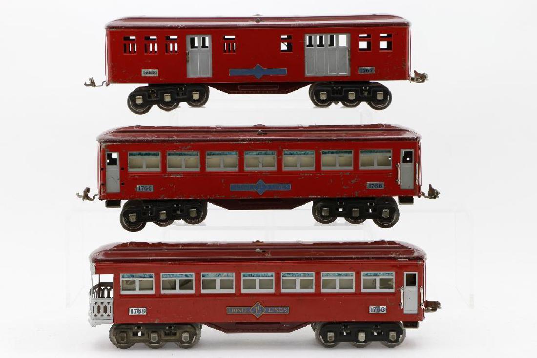 Lionel Standard Gauge Passenger Set: #1766 baggage, #1767 pullman, #1768 observation (some hand rails missing), red, silver inserts, maroon roofs- set in very good condition