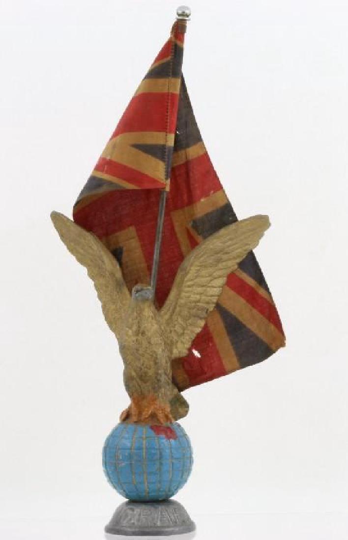 C.R.A.F.A. PAINTED MASCOT WITH FLAG: Tears in flag Height: 11 inches