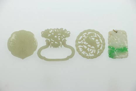 A GROUPING OF ASIAN JADES: A group of four reticulated jade plaques Largest example approximately 2 1/2 inches