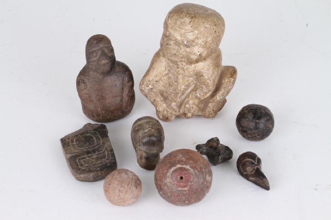 Group of ancient Mesoamerican items: Including two Olmecoid stone figures; a bird head bead/pendant; and other examples Largest example height: 3 1/4 inches