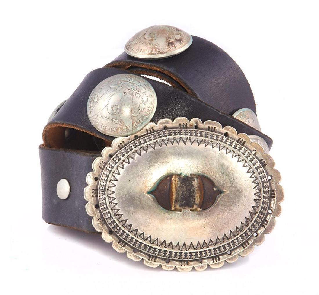 A NAVAJO CONCHO BELT: Southwest Old Pawn concho sterling silver dollar and turquoise belt. Stamped: Sterling and with a maker's mark, "Tom
