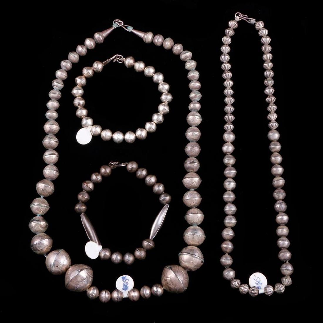 SOUTHWEST JEWELRY: Two Native American silver beaded necklace and two beaded bracelets Size: 10 1/2" in length (necklace) Weight: 88 g total