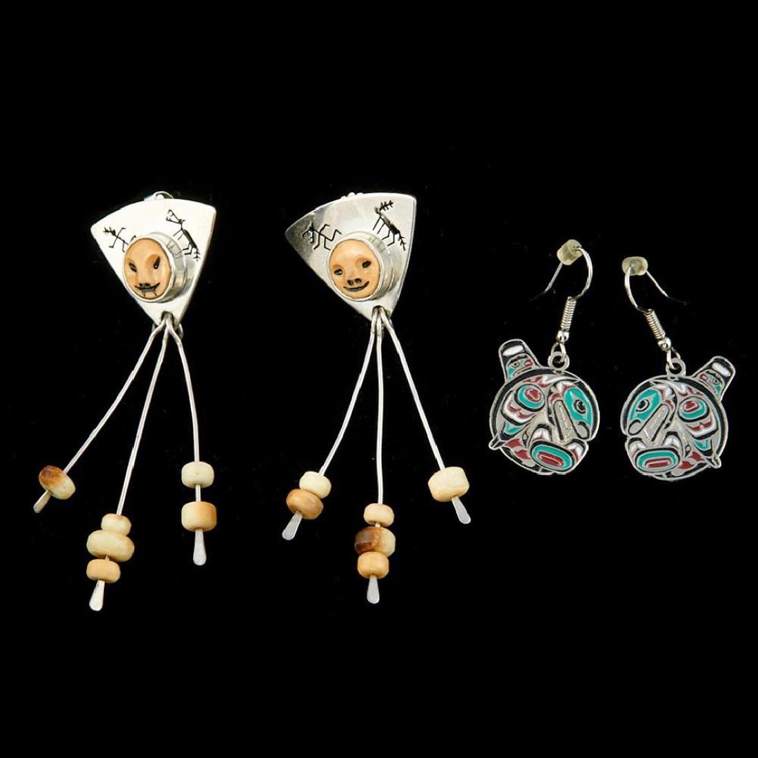 PAIR OF CHUGACH ALEUT EARRINGS: Denise Wallace; along with a pair of commercially produced Northwest Coast-style earrings. Length 2 3/4 inches
