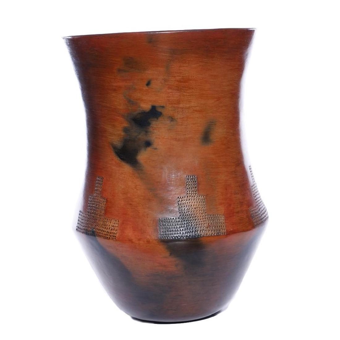 NAVAJO POTTERY VASE: Alice Cling, decorated with stepped impressions and prominent fireclouds. Height 15 1/2 inches, diameter 11 inches