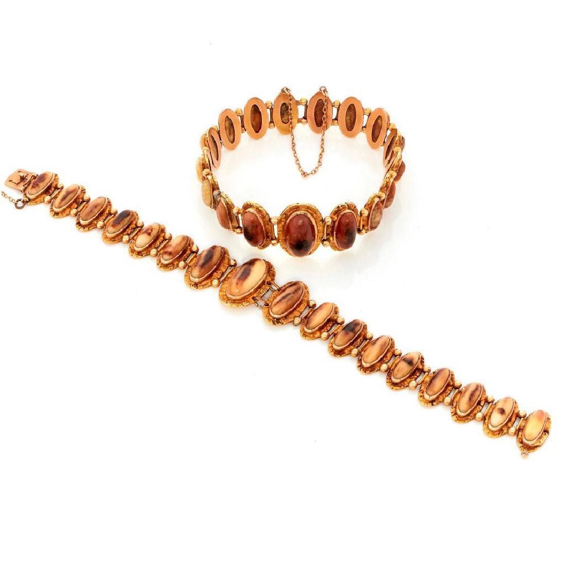 Pair of horn, gold nugget, and 14k gold link bracelets: Gold rush era gross weight approximately 60.4g; lengths: 7 and 7 1/2in. Buyer pays shipping cost of $37.50 in the USA (plus 2% of the hammer price for insurance). All packages must be insured for at l