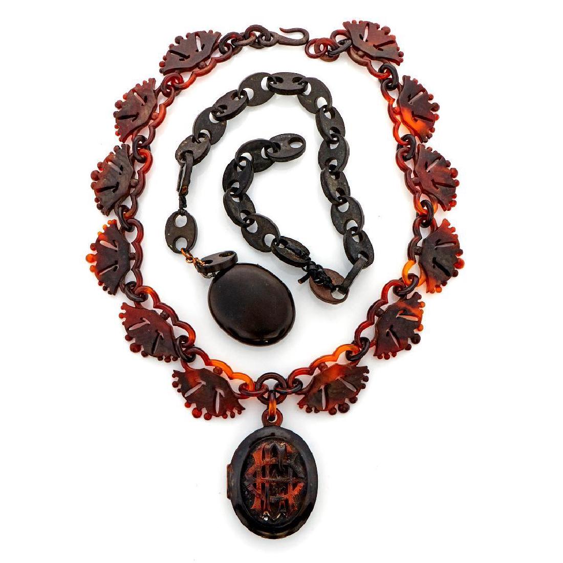 Two Victorian locket-necklaces: one gutta percha and one tortoise shell; lengths: 16 and 20in. Buyer pays shipping cost of $37.50 in the USA (plus 2% of the hammer price for insurance). All packages must be insured for at least the 