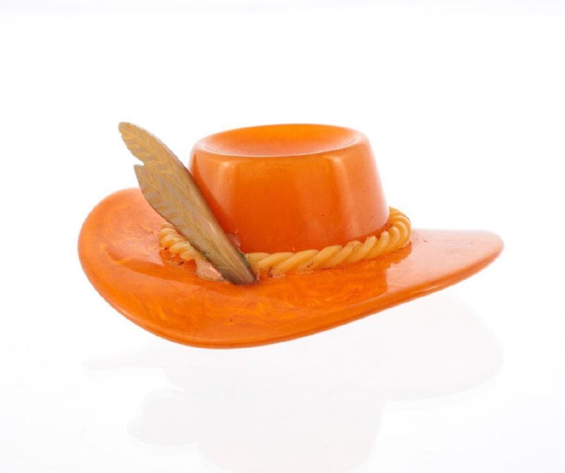 Vintage large "Chunky" bakelite butterscotch hat brooch: with feather and band; length: 3in. (pin stem broken)