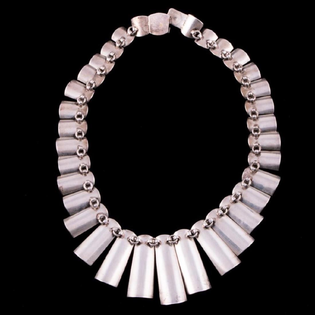 A Nelson Burbank Sterling Necklace: A Nelson Burbank sterling necklace. Largest example is approximately: 1 3/4 inches (wide). Approximate size: 8 1/4 inches long. Approximate total weight: 130 g. Marked: NB.
