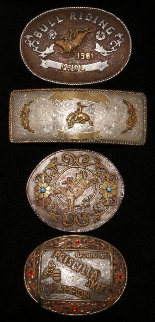 SOUTHWEST SILVER BELT BUCKLES: Four Vintage pawn Southwest Silver Belt Buckles. 1981"Bull Riding". "Region VI Priscilla Skeet Champion". Makers: H.W. and CS. The largest example is approximately 5 3/4inches. Approximate total weigh