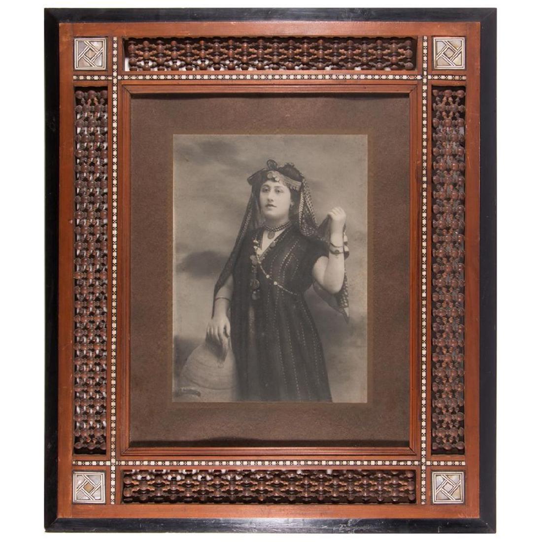 Framed photograph of a Middle Eastern woman. (1 of 3)