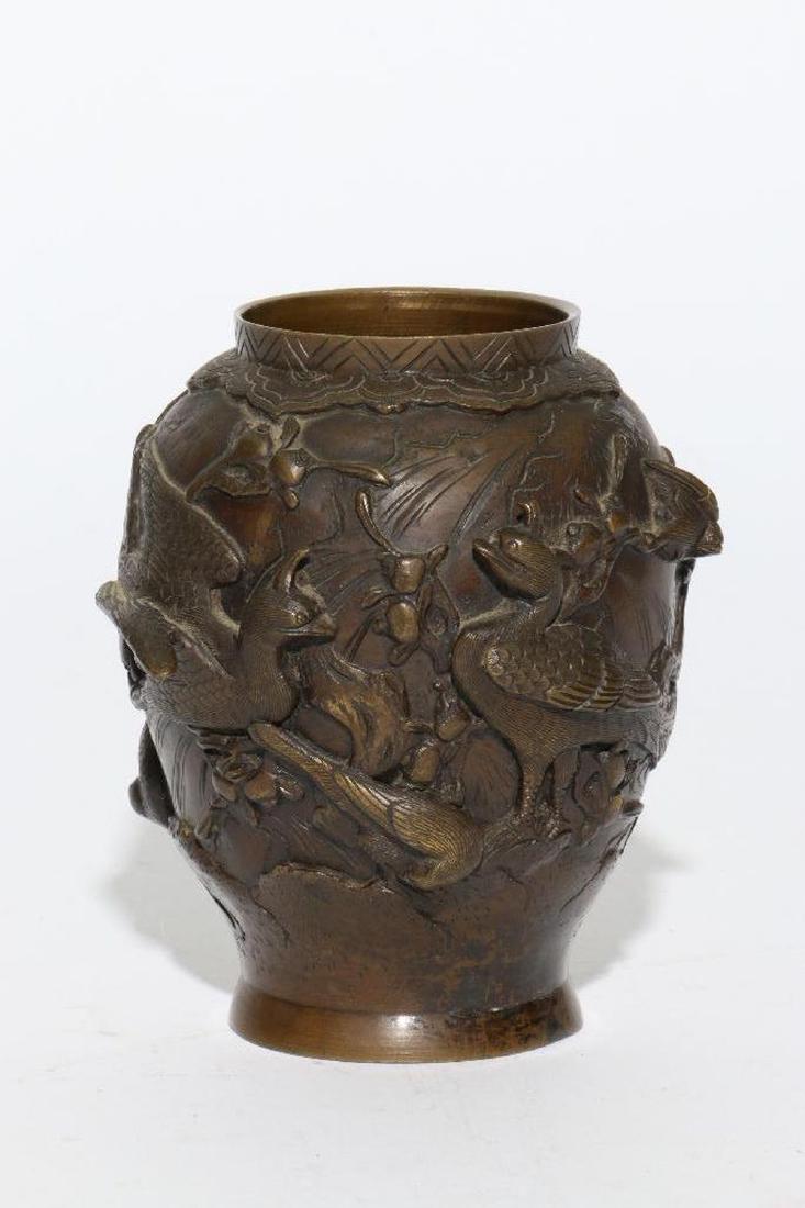 A Japanese Meiji bronze vase.: A late 19th/early 20th century Japanese Meiji bronze vase depicting various birds, 5 inches high. .