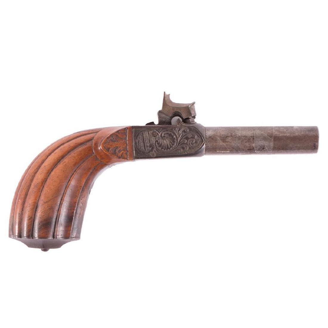 A mid 19th century double barreled derringer: A 19th century Continental derringer finely carved and inscribed.