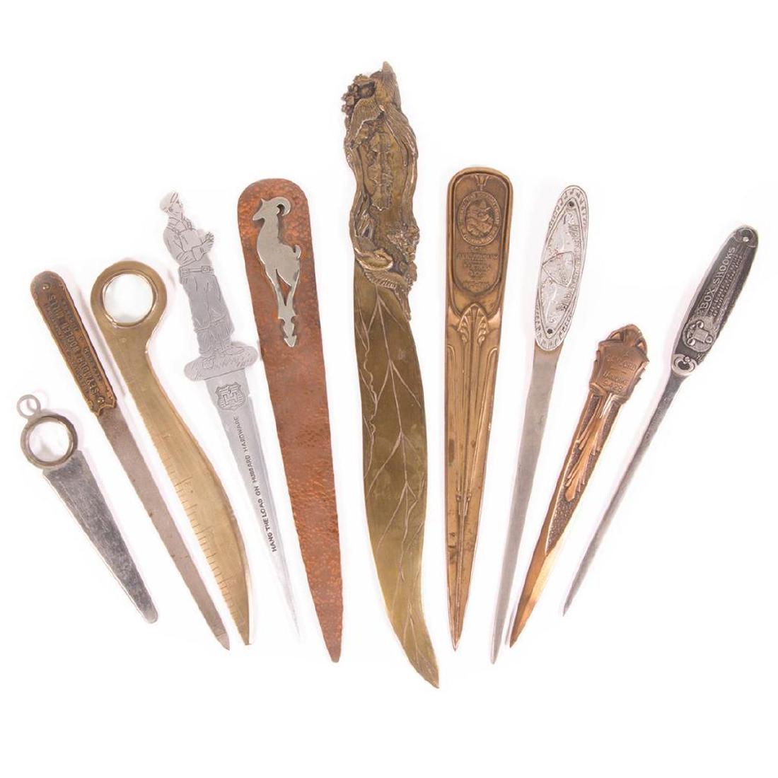 Ten cast metal letter openers.: Ten various cast metal 20th century letter openers, two with magnifying glasses.