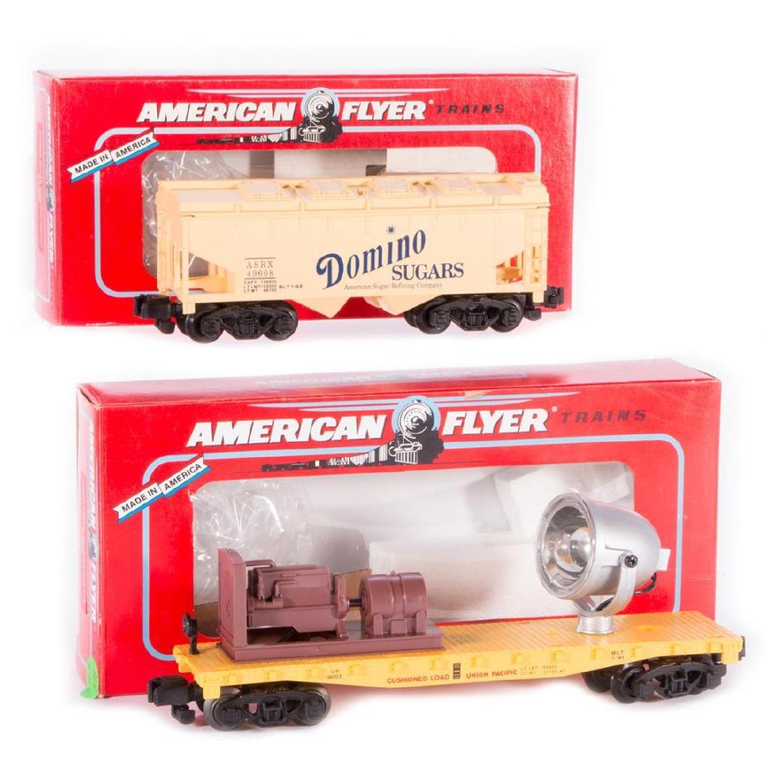 AF S 6-49608 Domino Hopper, 6-49003 UP Searchlight Car: AF S 6-49608 Domino Covered Hopper and 6-49003 Union Pacific Searchlight Car with original boxes. Both cars are C9-C10.