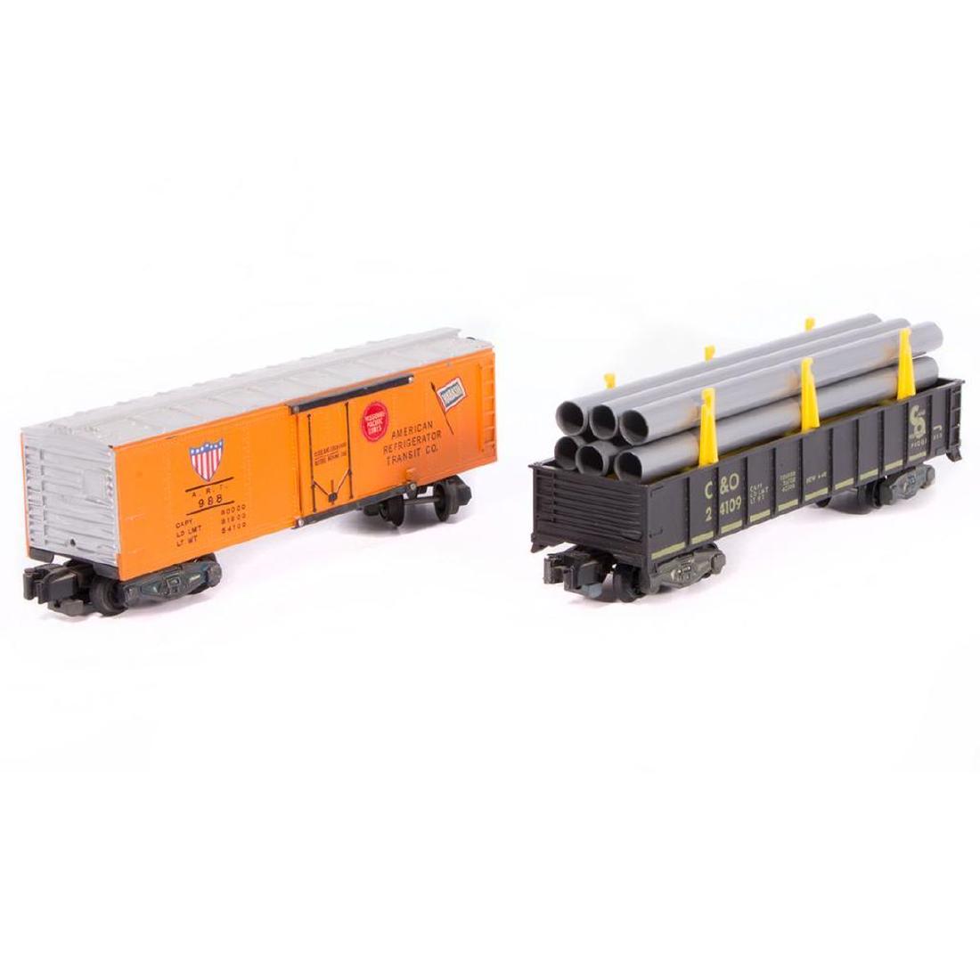 AF S 24109 Pipe Car and 988 ART Reefer: Two very nice original AF S gauge freight cars, 24109 Pipe Car and 988 ART Reefer. 24109 is C8-C9, 988 has minor roof walk ding but perfect herald stickers and is C8. The spring retainers are missing