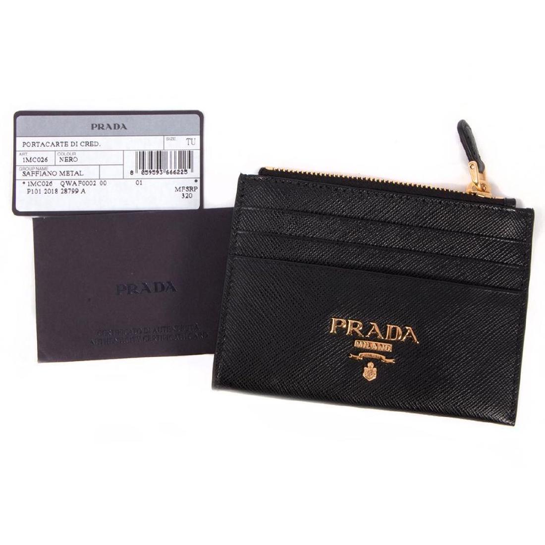 Prada Saffiano Metal Black Zipper Credit Card/Change: new, with original tag and authenticity card; measuring 4 7/8 x 3 1/2in.; original retail $320