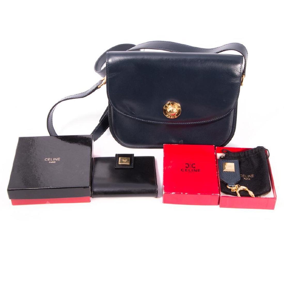 Celine Paris Navy Blue Flap Purse with Celine black: Celine Paris Navy Blue Flap Purse with Celine black leather wallet Made in Italy, purse with red interior, 8 1/2 x 7in, with keychain pouch and box, very light wear; wallet measuring 3 3/4 x 4in., wit