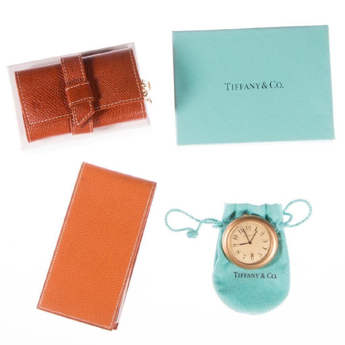 Collection of Designer Accessories: including a Prada leather note pad, Tiffany & Co. circular travel clock with pouch, Tiffany & Co. playing cards (unopened), and Jaeger LeCoultreÂ key case